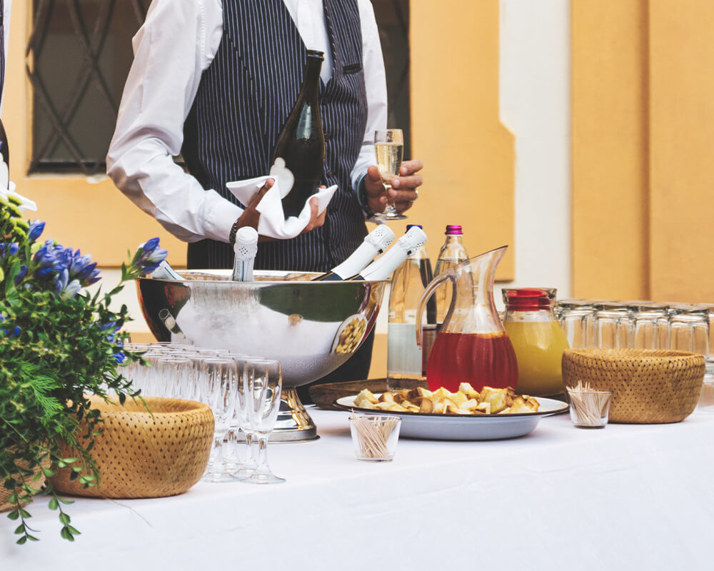 Bartenders are serving drinks at wedding reception